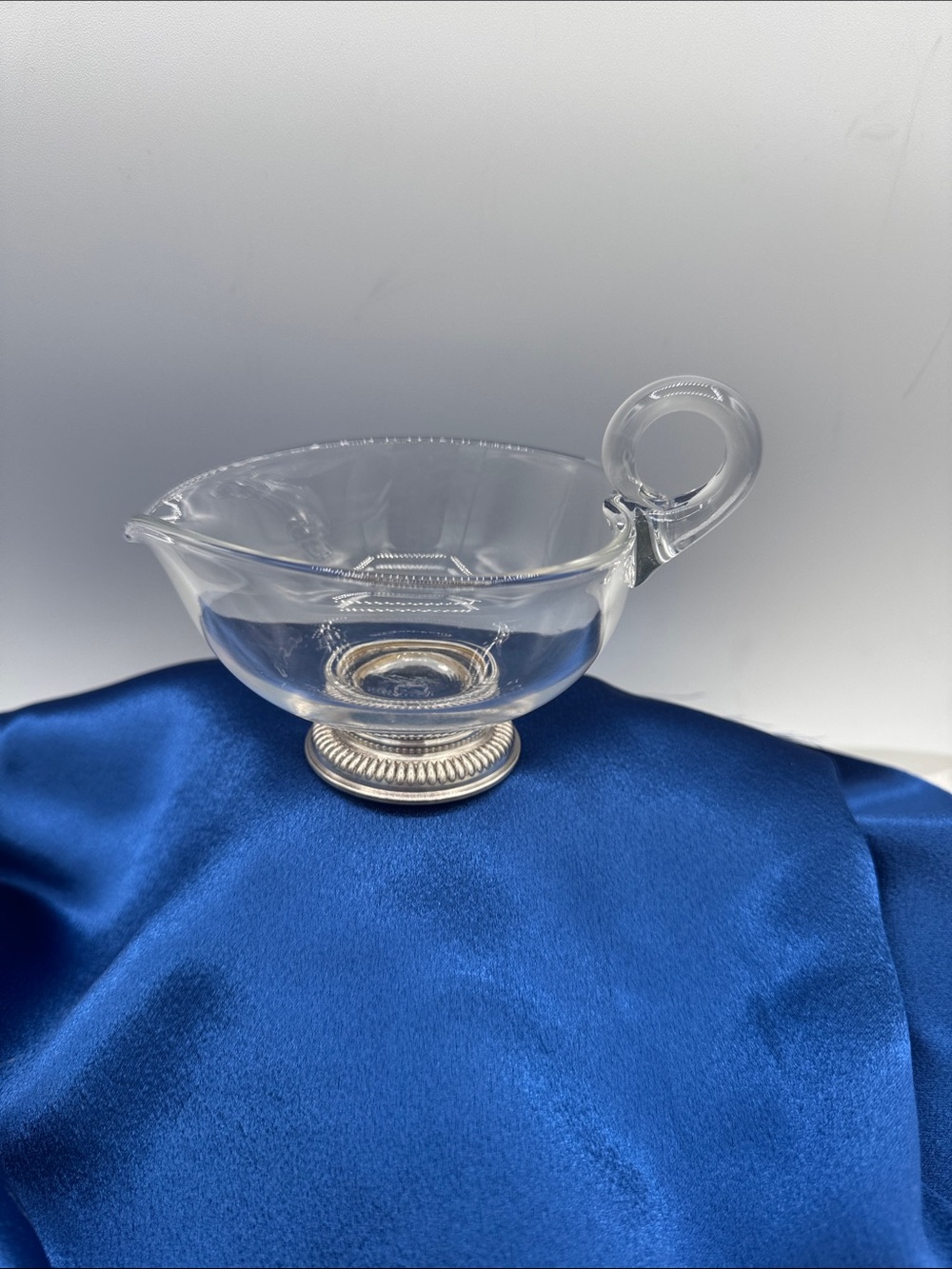 #3 Clear Glass Serving Bowl with Loop Handle and Sterling marked base.